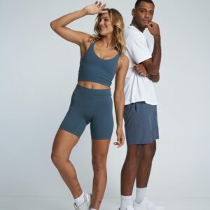 Woman and Man Posing in Gym Clothing