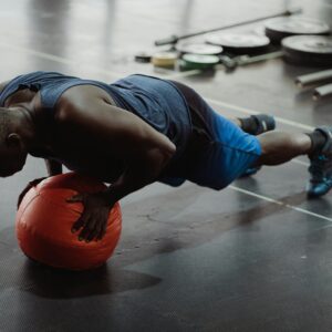 Man in Blue Tank Top and Blue Shorts Doing Push Up